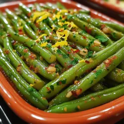 If you're seeking a vibrant and healthy side dish that not only enhances your everyday meals but also shines at special gatherings, look no further than Zesty Lemon-Garlic Green Beans. This delightful recipe combines the fresh, crisp texture of green beans with the bright, zesty flavors of lemon and the pungent aroma of garlic. It’s a perfect accompaniment to a variety of main dishes, whether you’re serving grilled chicken, roasted fish, or a hearty vegetarian entrée.